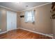 Bedroom with hardwood floors, closet, and window at 1925 Pl Propst Rd, Maiden, NC 28650