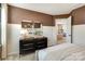 Cozy bedroom with dresser and access to another room at 2101 Bayou Trace Dr # Lot 9, Charlotte, NC 28262