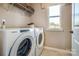 Convenient laundry room with side-by-side washer and dryer at 2101 Bayou Trace Dr # Lot 9, Charlotte, NC 28262