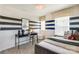 Stylish bedroom with navy and white striped wall and comfortable bed at 2105 Bayou Trace Dr, Charlotte, NC 28262