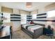 Cozy bedroom with navy and white striped wall and built-in bed at 2109 Bayou Trace Dr # Lot 11, Charlotte, NC 28262