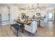 Bright dining area with a wood table and modern light fixtures at 2109 Bayou Trace Dr # Lot 11, Charlotte, NC 28262