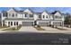 Townhomes with gray garage doors and well-maintained landscaping at 2109 Bayou Trace Dr # Lot 11, Charlotte, NC 28262