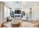 Open living area showcasing a fireplace and ample natural light at 2109 Bayou Trace Dr # Lot 11, Charlotte, NC 28262
