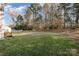 Landscaped backyard with grassy area and wooden fence at 2545 Thames Ct, Lancaster, SC 29720