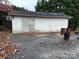 Detached garage with metal roll-up door and storage space at 323 Breslin St, Wadesboro, NC 28170