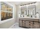 Double vanity bathroom with large window at 335 Eastcliff Se Dr, Concord, NC 28025