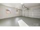 Attached garage with ample space and overhead storage at 335 Eastcliff Se Dr, Concord, NC 28025