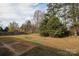 Large backyard with a grassy area and a concrete patio at 416 Carlyle Rd, Troutman, NC 28166