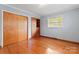 Spacious bedroom featuring hardwood floors and ample closet space at 4620 Sherrills Ford Rd, Salisbury, NC 28147