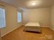 Bright bedroom with wood floors and window blinds at 4761 Sand Clay Rd, Hickory, NC 28602