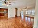 Open concept living and kitchen area with hardwood floors and ceiling fans at 4761 Sand Clay Rd, Hickory, NC 28602