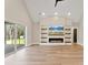 Living room with hardwood floors, fireplace, and sliding glass doors to a deck at 555 Riddle Mill Rd, Clover, SC 29710