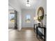 Bright and airy entryway with wood floors, a mirror, and a bench at 622 Amberjack Pl, York, SC 29745