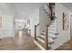 Modern staircase with wooden railing and light-colored walls at 622 Amberjack Pl, York, SC 29745