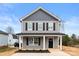 Two-story house featuring gray siding, black shutters, and a front porch at 624 W Kerr St, Salisbury, NC 28144