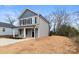 Two-story house with gray and dark gray siding, front porch and driveway at 624 W Kerr St, Salisbury, NC 28144