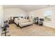 Spacious main bedroom with carpeted floor, large bed, and two windows at 6514 Ellimar Field Ln, Charlotte, NC 28215