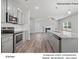 Modern kitchen with stainless steel appliances and gray cabinets at 7309 Greenrock Ct, Charlotte, NC 28215