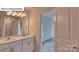 Double vanity bathroom with access to bedroom at 8030 Kennesaw Dr, Gastonia, NC 28056