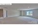 Spacious bonus room with large window and carpeted floors at 8030 Kennesaw Dr, Gastonia, NC 28056