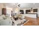 Living room featuring hardwood floors, ceiling fan, and an open concept layout at 8322 Curico Ln, Charlotte, NC 28227