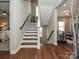 Elegant staircase with hardwood floors and a modern design at 946 Emory Ln, Fort Mill, SC 29708