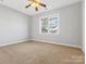 Spacious bedroom with neutral walls and carpet flooring at 11336 Deer Ridge Ln, Charlotte, NC 28277