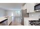 Bright kitchen featuring stainless steel appliances and hardwood floors at 14057 Castle Nook Dr, Charlotte, NC 28273