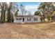 Gray house with white trim, a front porch, and a well-maintained lawn at 1637 Sumner Dr, Rock Hill, SC 29732