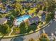 Aerial view of community pool with surrounding lounge area at 204 Planters Way, Mount Holly, NC 28120