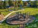 Community playground with play structures and picnic shelters at 204 Planters Way, Mount Holly, NC 28120