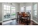 Eat-in kitchen with sliding glass door to the patio, white cabinets, and dark wood floors at 210 South Haven Dr, Mooresville, NC 28117