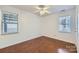 Bright bedroom with hardwood floors and two windows at 2424 Pitts Dr, Charlotte, NC 28216