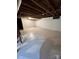 Unfinished basement with high ceilings and painted walls at 2930 W Innes St, Salisbury, NC 28144