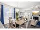 Dining area with wooden table and chairs, adjacent to the living room at 4050 Chelsea Dr, Denver, NC 28037