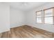 Well lit bedroom with wood flooring and window blinds at 494 Washington St, Cramerton, NC 28032