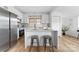 Modern kitchen with white cabinets, stainless steel appliances, and an island at 494 Washington St, Cramerton, NC 28032