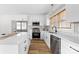 Modern kitchen with white cabinets, stainless steel appliances, and an island at 494 Washington St, Cramerton, NC 28032