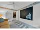 Spacious bedroom featuring a chalkboard wall and view into living area at 5017 Celeste Ct, Charlotte, NC 28270