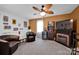 Cozy bonus room featuring a fireplace, comfy seating, and a large TV at 5017 Celeste Ct, Charlotte, NC 28270