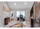 Home office with built-in shelving, large desk, and plenty of natural light at 5017 Celeste Ct, Charlotte, NC 28270