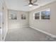 Bright bedroom with grey carpet and multiple windows at 529 Catalina Dr, Albemarle, NC 28001