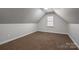 Large bedroom with carpeted floors and a window at 711 Crystal Lynn Dr, Lowell, NC 28098