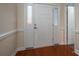 White front door with sidelights, hardwood floors, and access to another room at 711 Crystal Lynn Dr, Lowell, NC 28098