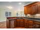 Kitchen features corner sink, granite countertops, and ample cabinet space at 711 Crystal Lynn Dr, Lowell, NC 28098