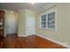 View of kitchen area with hardwood floors and additional storage at 711 Crystal Lynn Dr, Lowell, NC 28098