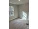 Charming bedroom with large window and neutral decor at 715 Ne Branchview Ne Dr, Concord, NC 28025