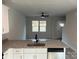 Modern kitchen with white cabinets, granite counters, and stainless steel sink at 715 Ne Branchview Ne Dr, Concord, NC 28025