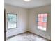 Well-lit bedroom with hardwood floors and two windows at 123 Oak St, Chester, SC 29706